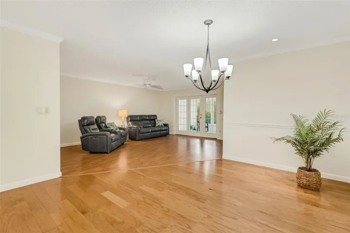 Wood floors, crown molding & chair rail in the dining area~