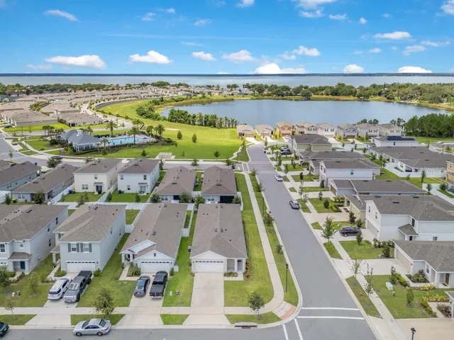 Ariel view with community pool, small Lake Hermosa and Lake Eustis in the background