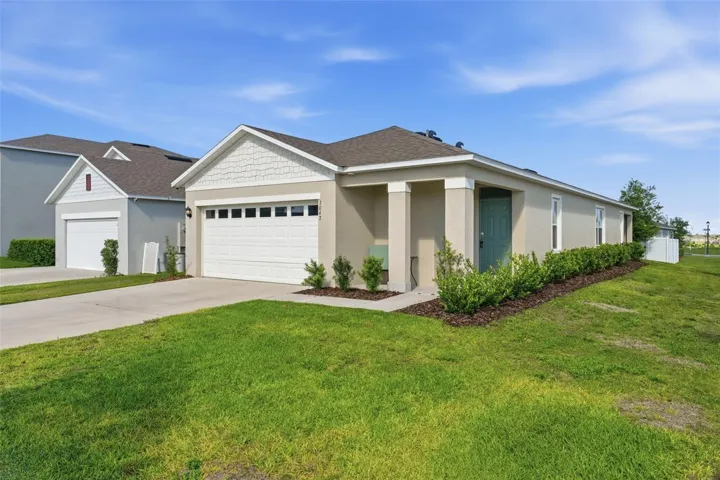 Profile of home with NEW landscaping after freeze