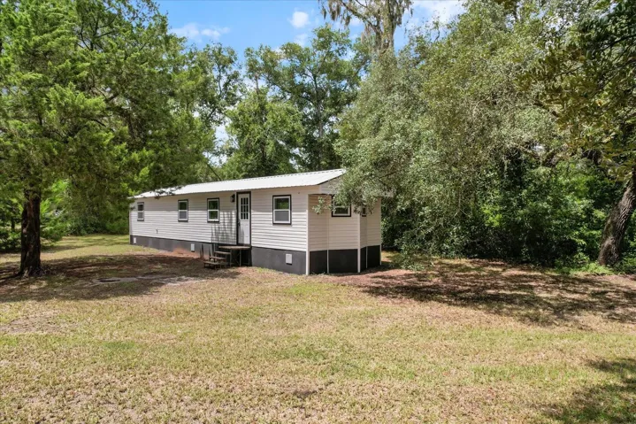 Welcome Home!...Newly Renovated w/ NEW Roof, NEW HVAC, NEW Vinyl Siding, NEW Windows & Doors and NEW Concrete Skirting