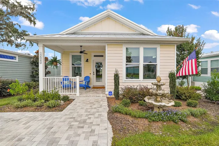 Attractive landscaping and pavered sidewalk.
