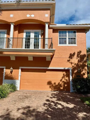 Street view, balcony off the main bedroom, oversized two car garage