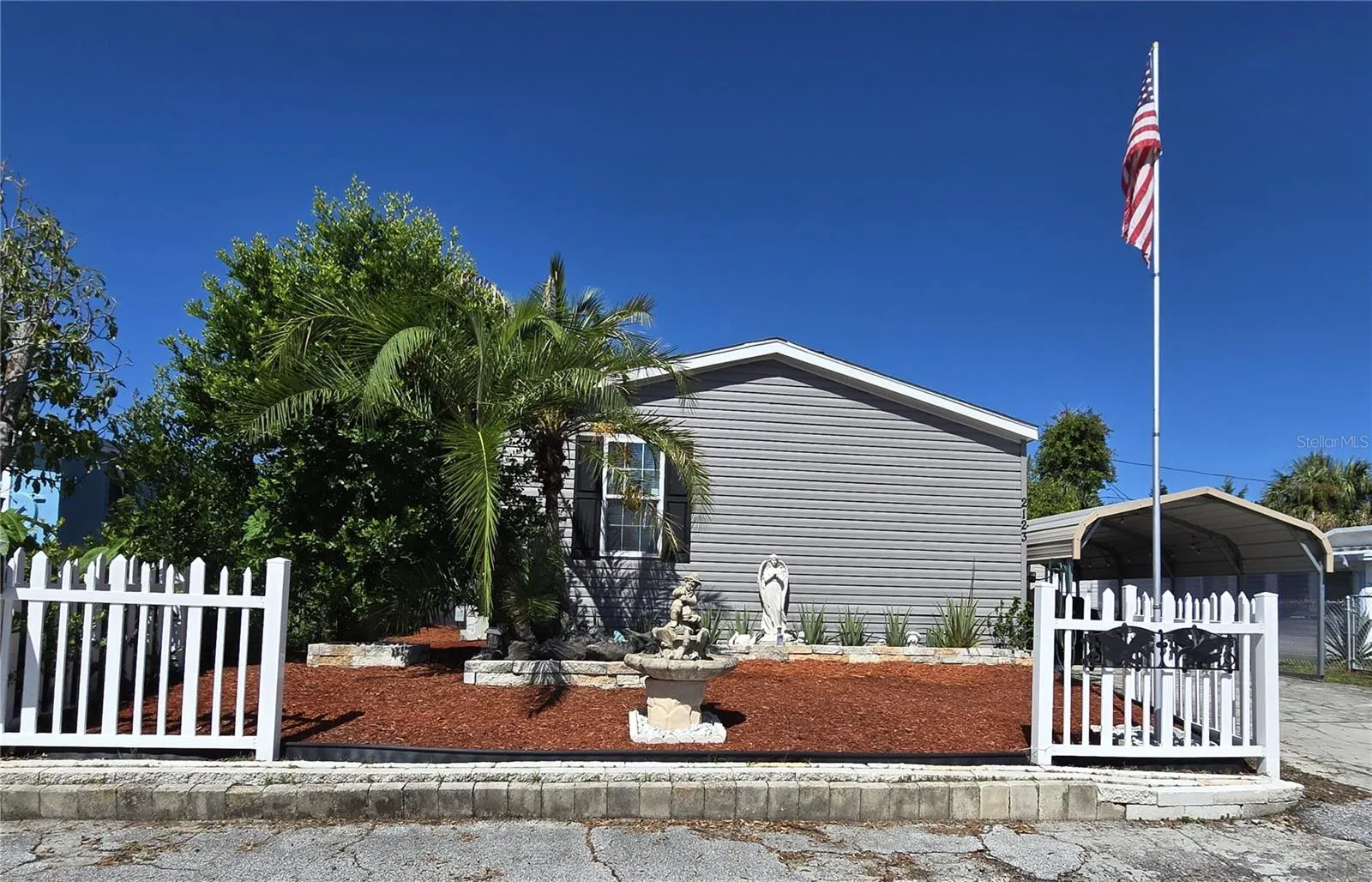 Gorgeous curb appeal with lush landscaping