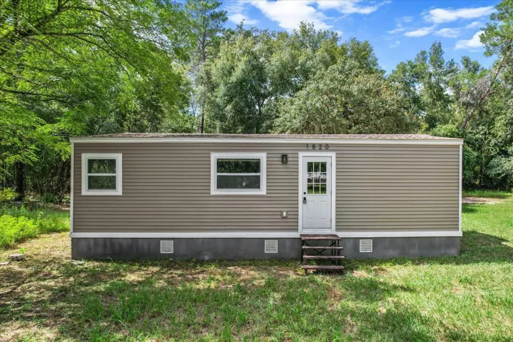 Welcome Home!...Newly Renovated w/ NEW Roof, NEW HVAC, NEW Vinyl Siding, NEW Windows & Doors and NEW Concrete Skirting