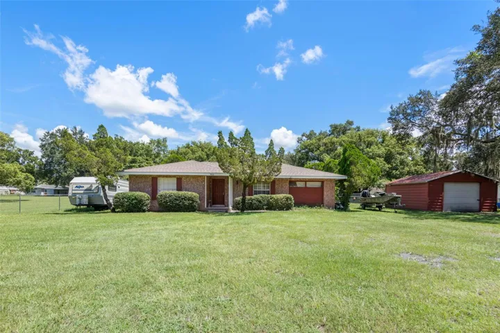 FRONT OF HOME & DETACHED GARAGE/WORKSHOP