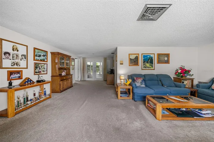 From front door entry way looking out to the backyard and lanai area.  Look at the beautiful French doors large enough to accommodate a wheelchair.