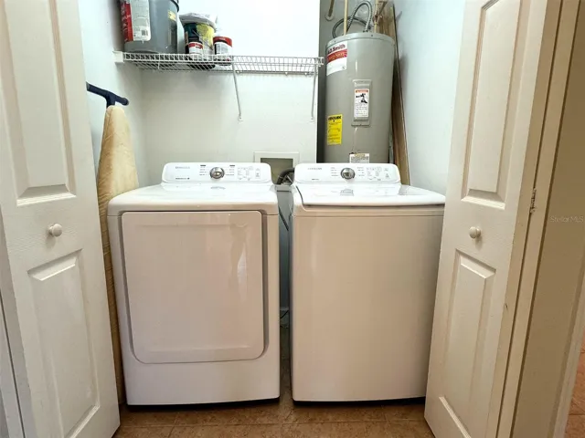 Laundry closet and water heater.