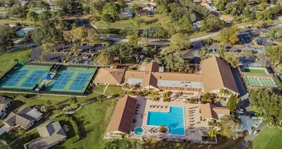 AERIAL VIEW OF THE MAIN CLUBHOUSE SHOWING POOL,SPA,TENNIS AND SHUFFLE BOARD COURTS