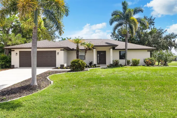 Front of home with impact rated with new garage door