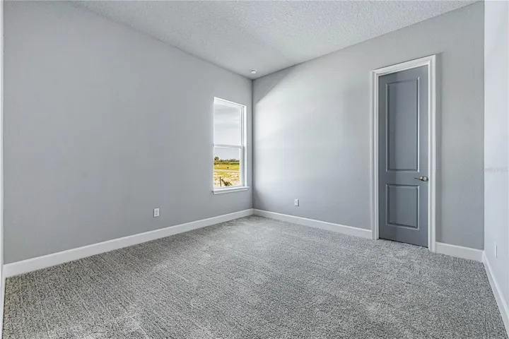 Bedroom 3 w/Walk-in Closet & Window
