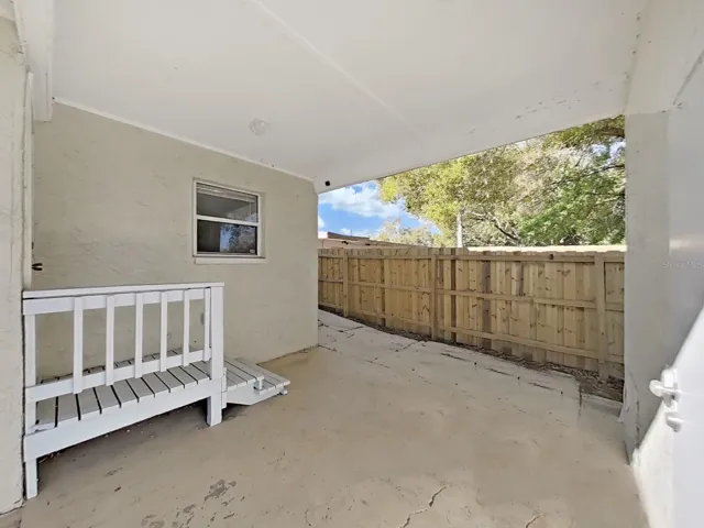 Covered patio, rear entrance to home
