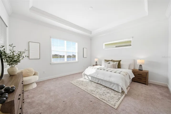 Primary bedroom with lake view.
