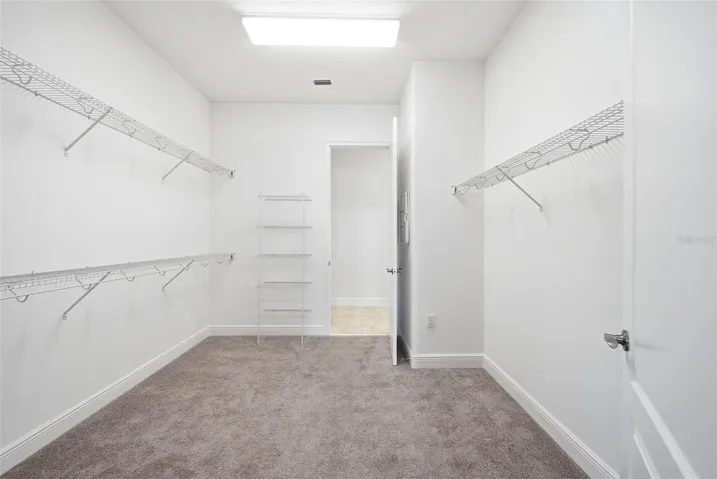 Primary walk-in closet.