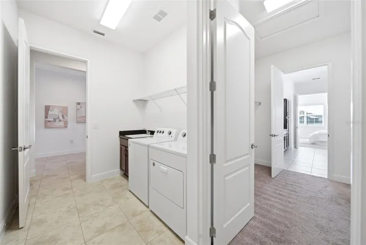 Utility room adjacent to Primary closet and bedroom.