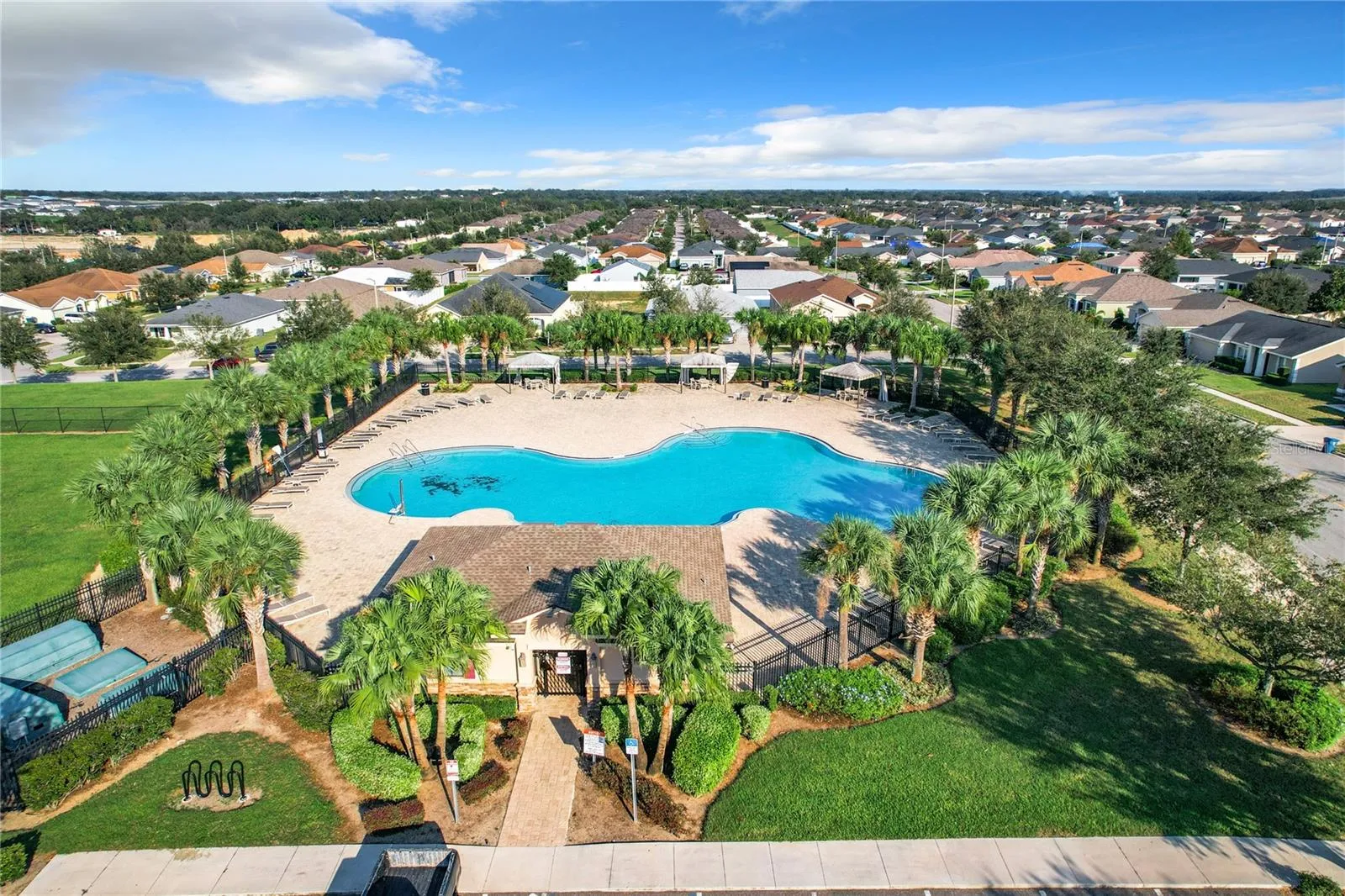 COMMUNITY POOL AND PLAYGROUND DRONE VIEW 3