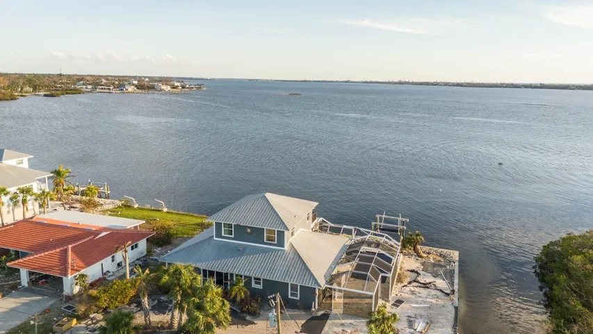 Gorgeous unobstructed saltwater views. On a corner lot boasts beautiful southward views of sweet LEMON BAY. Bordered by canal and Lemon Bay Park on the Right.