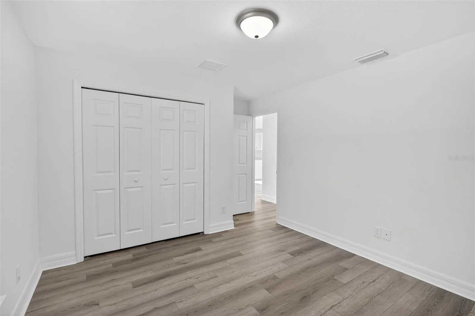 Third bedroom with view of closet