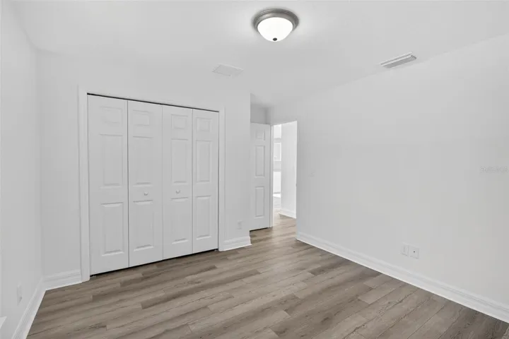 Third bedroom with view of closet