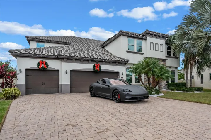 This stunning Mediterranean-style home is nestled on one of the largest lots in the prestigious Parkside neighborhood