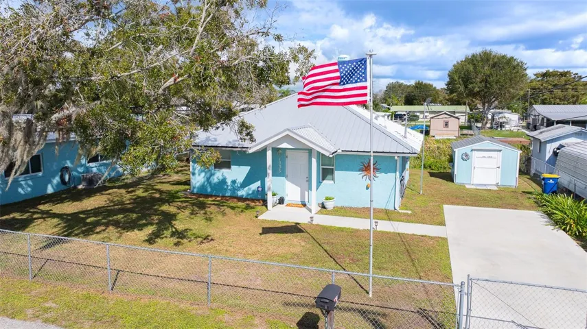Features Cottage and She Shed. Main home to the left