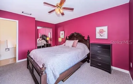 primary bedroom with adjoining half bath