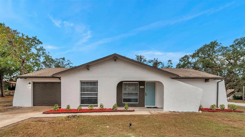 Beautiful front view of the home, offering a welcoming entrance and a glimpse of the spacious property.