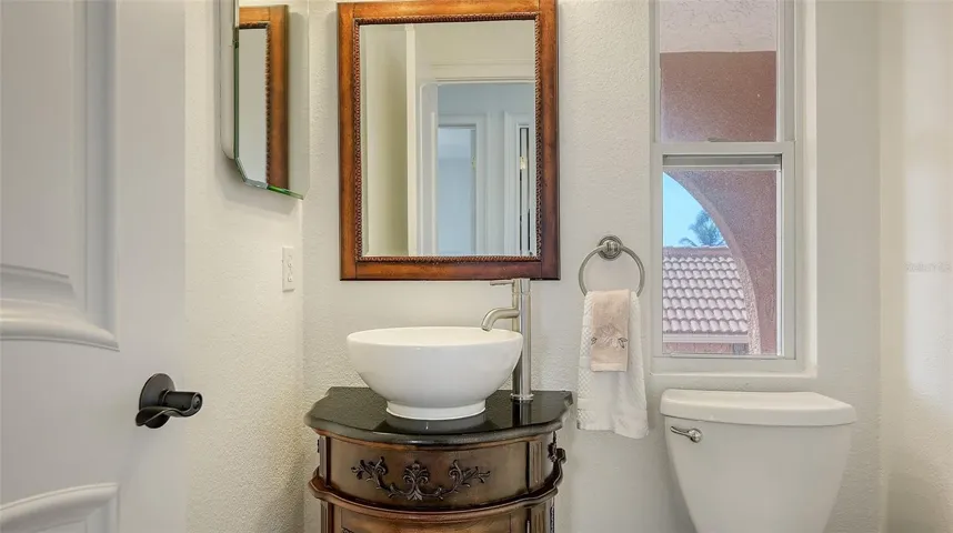 Half bath located to the right when you come up the stairs.