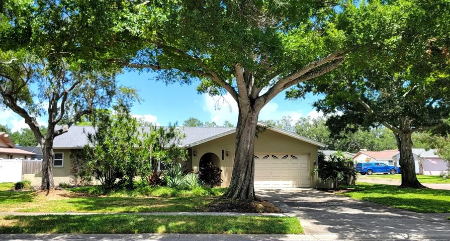 Great curb appeal, large corner lot & a pool!