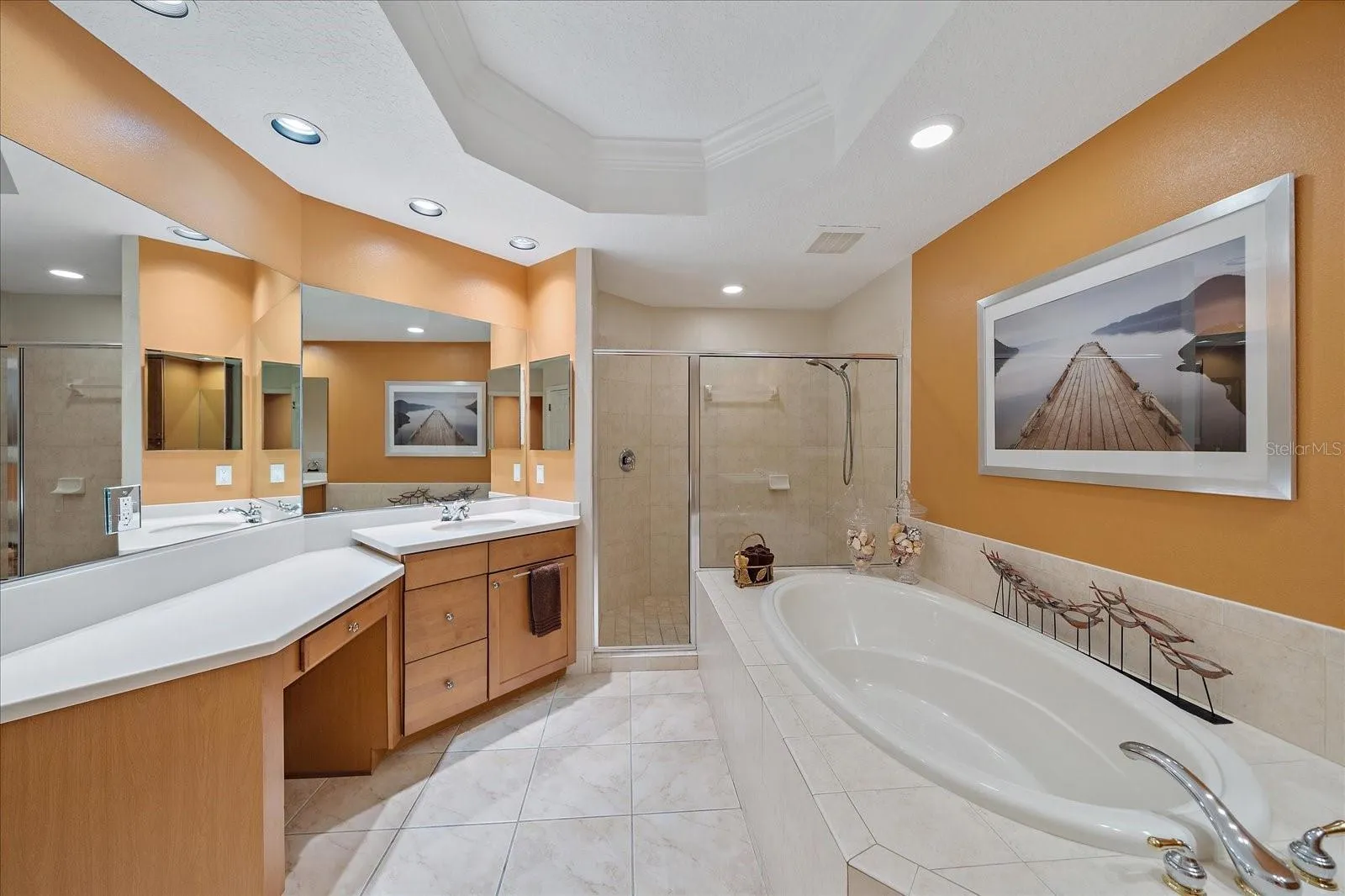 Primary ensuite bathroom - dual sinks, vanity space, separate shower stall