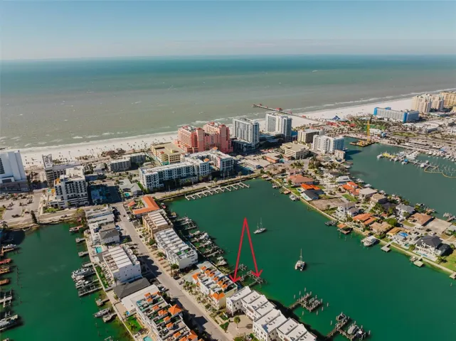 5-minute walk to Clearwater Beach restaurants and shopping!  Premium Waterfront Community – Harborside Townhomes! 4 Level Luxury Townhome with DEEPWATER BOAT SLIP with Lift, 3 Car Garage - half converted into BONUS ROOM, ROOFTOP TERRACE with $11K turf upgrade, Private ELEVATOR that services all floors INCLUDING ROOFTOP TERRACE, low $575 monthly fee and ALLOWS 7-DAY RENTALS - a very rare find!