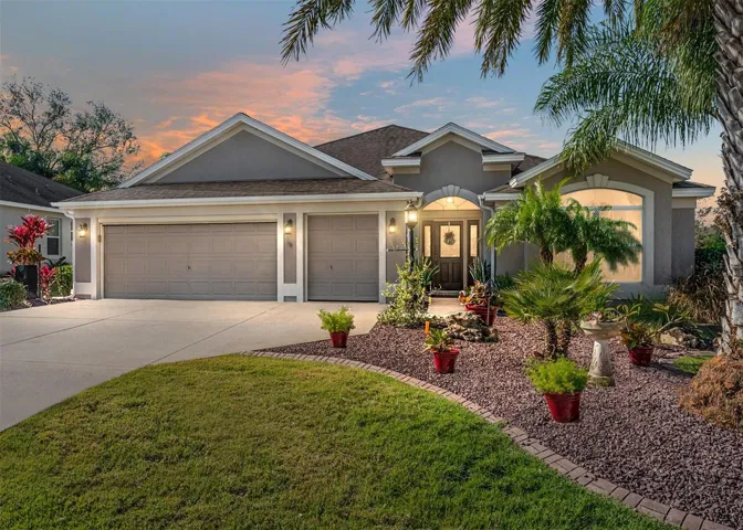 FRONT EXTERIOR @ Dusk - 525 Beaulieu Loop in the VILLAGE of AMELIA