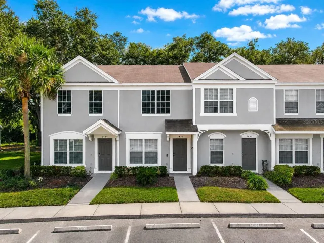 2 bedroom, 1 full bath, 1 half bath townhome with screened in porch.
