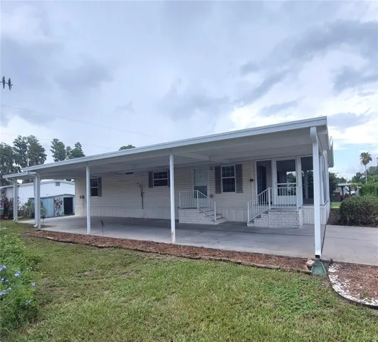 side view-carport runs the length of the house