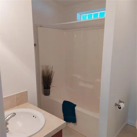 hall bath has tub with shower
