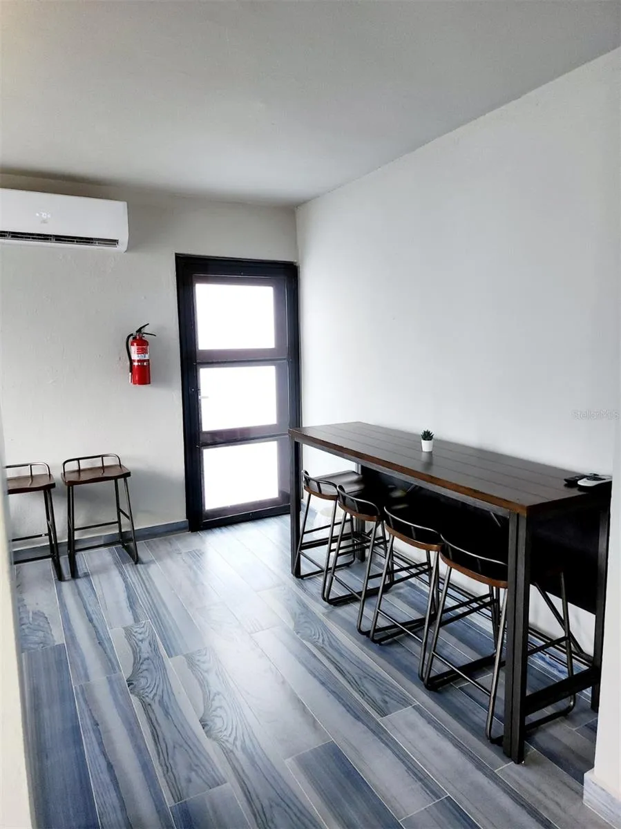 Apartment dinning room and side exit patio door