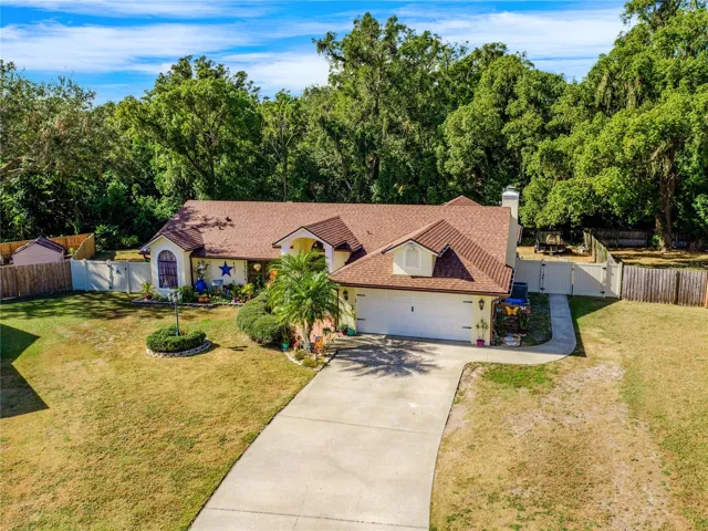 On an OVERSIZED .41 ACRE **CUL-DE-SAC** LOT this spacious home has private **WOODED VIEWS**, a **BRAND NEW POOL (2024)** and your major mechanicals have been updated!
