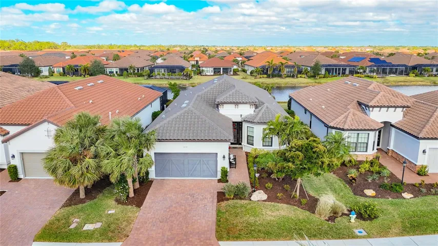 Lake view, landscape maint.-free ,impact glass, & 10 homes away from clubhouse amenities.