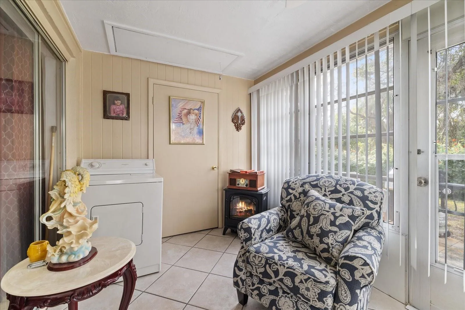 Climate controlled lanai with indoor Electrick clothes dryer and storage closet.