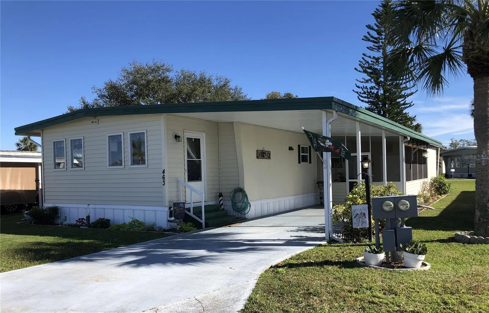 Front with carport and covered porch area
