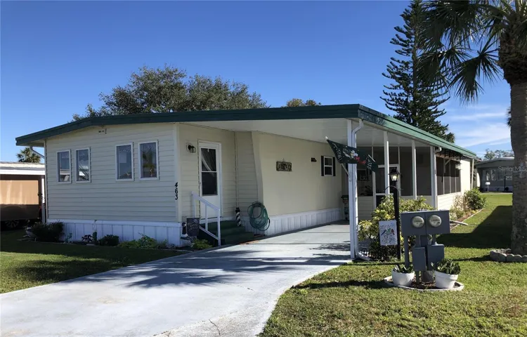 Front with carport and covered porch area