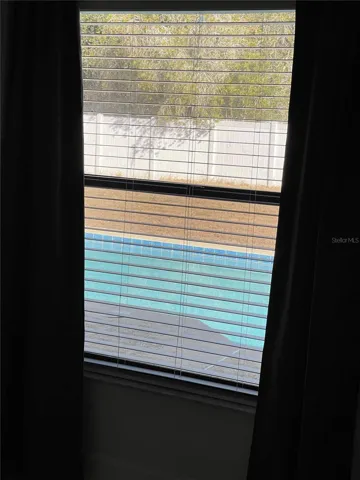 MASTER ROOM WINDOW WITH POOL VIEW