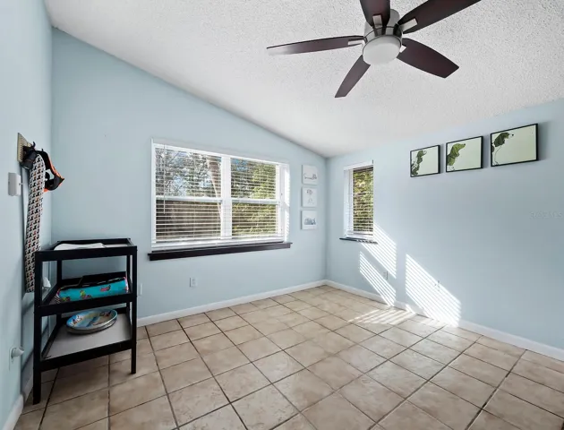Bedroom 3 with high ceilings and separate entry