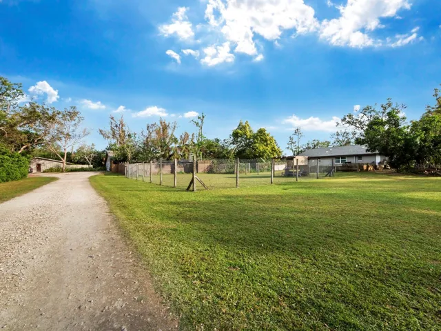 Separate driveway to updated guest house & updated kennel building