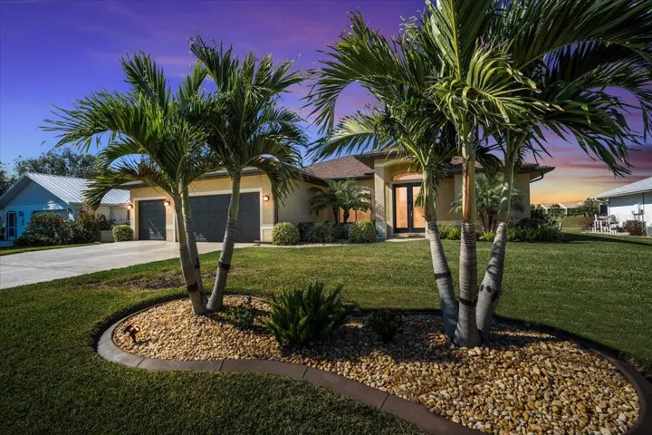 3 car garage home on Deep Creek Golf course. A beautifully landscaped property with 5 palms and pro vista insect resistant soft grass.
