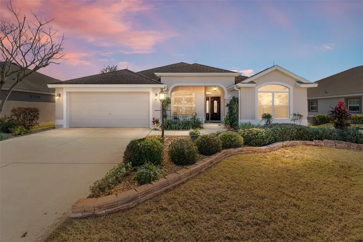 FRONT EXTERIOR at DUSK - Situated in the VILLAGE of DUVAL on 1290 James Island Street, this lovely GARDENIA Designer with 3 BR/ 2 BA/ 2 CAR GARAGE has NO HOMES BEHIND.