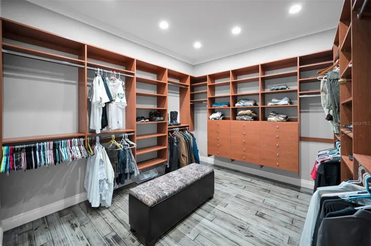 Upstairs master walk in closet -his