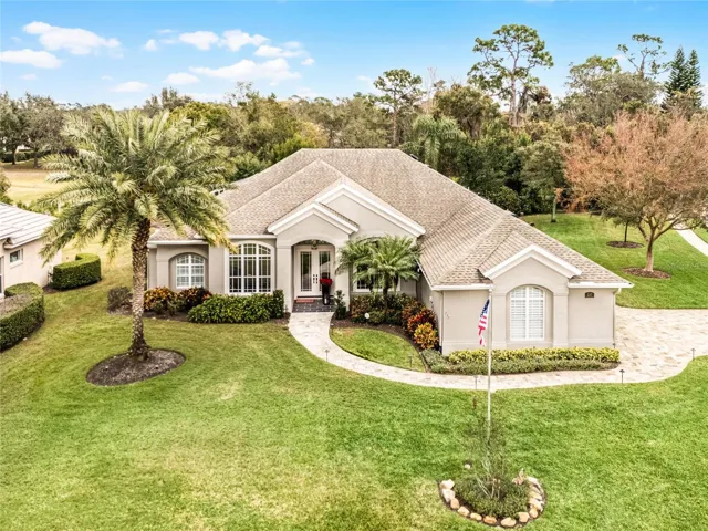 Gorgeous corner lot with side entry garage with paver driveway