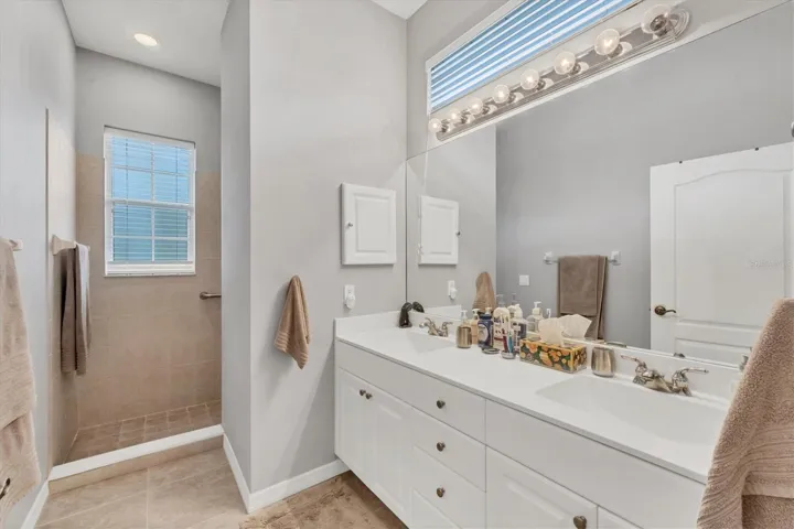 Primary Bath with double vanity sink and Roman shower
