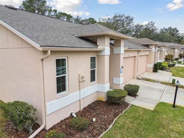 Front Entrance to Villa with 2 Car Garage - New Roof 2015 & Updated with Hurricane Windows & Doors - End Unit Villa with largest property on this street.