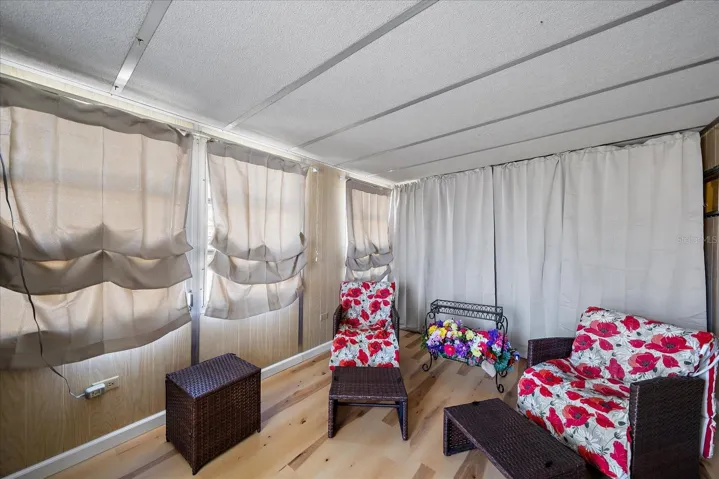From living room -- sunroom with central AC & heat  - can be family room, extra bedroom